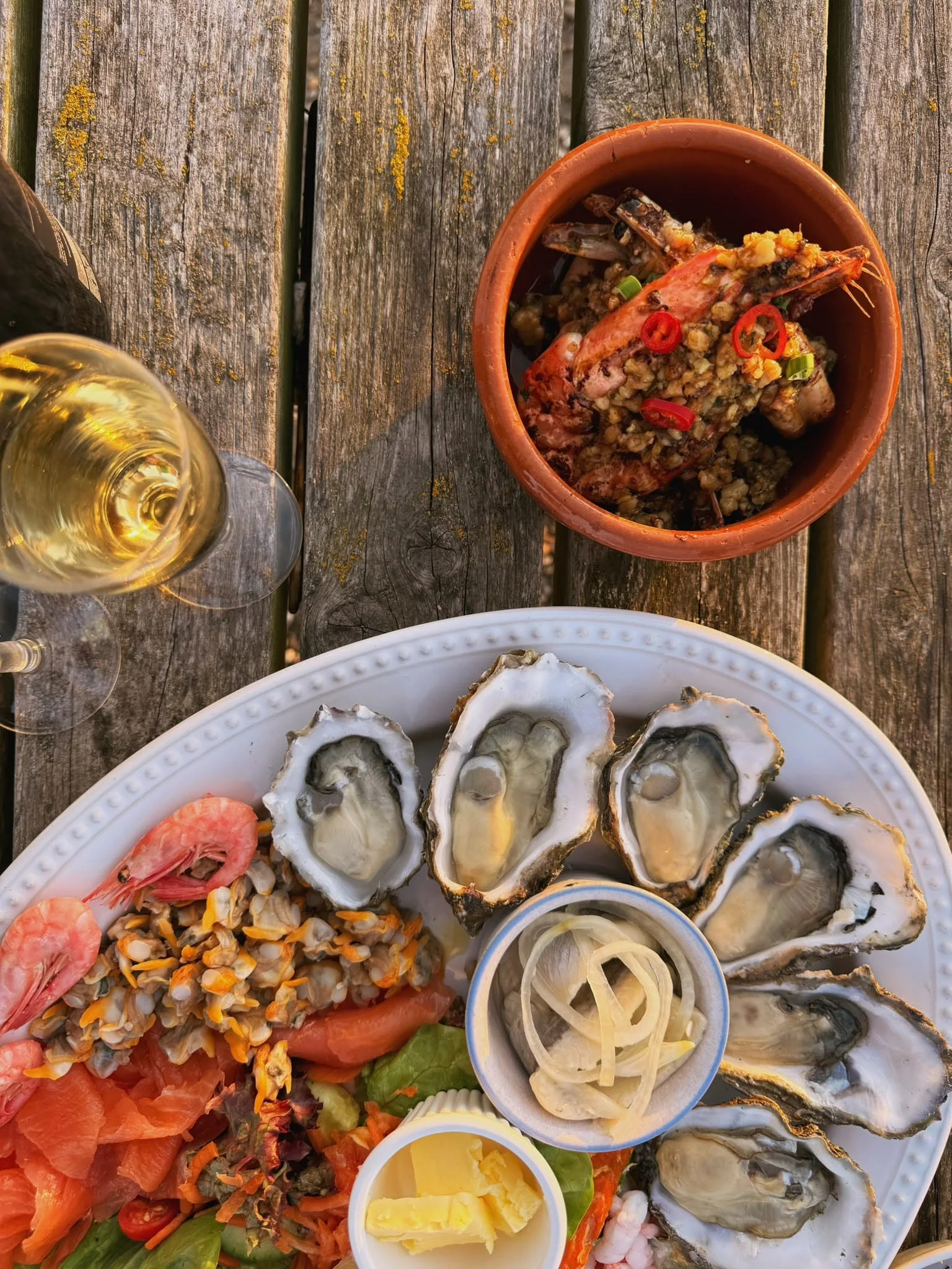 West Mersea oysters, prawns and smoked seafood served at a waterside table