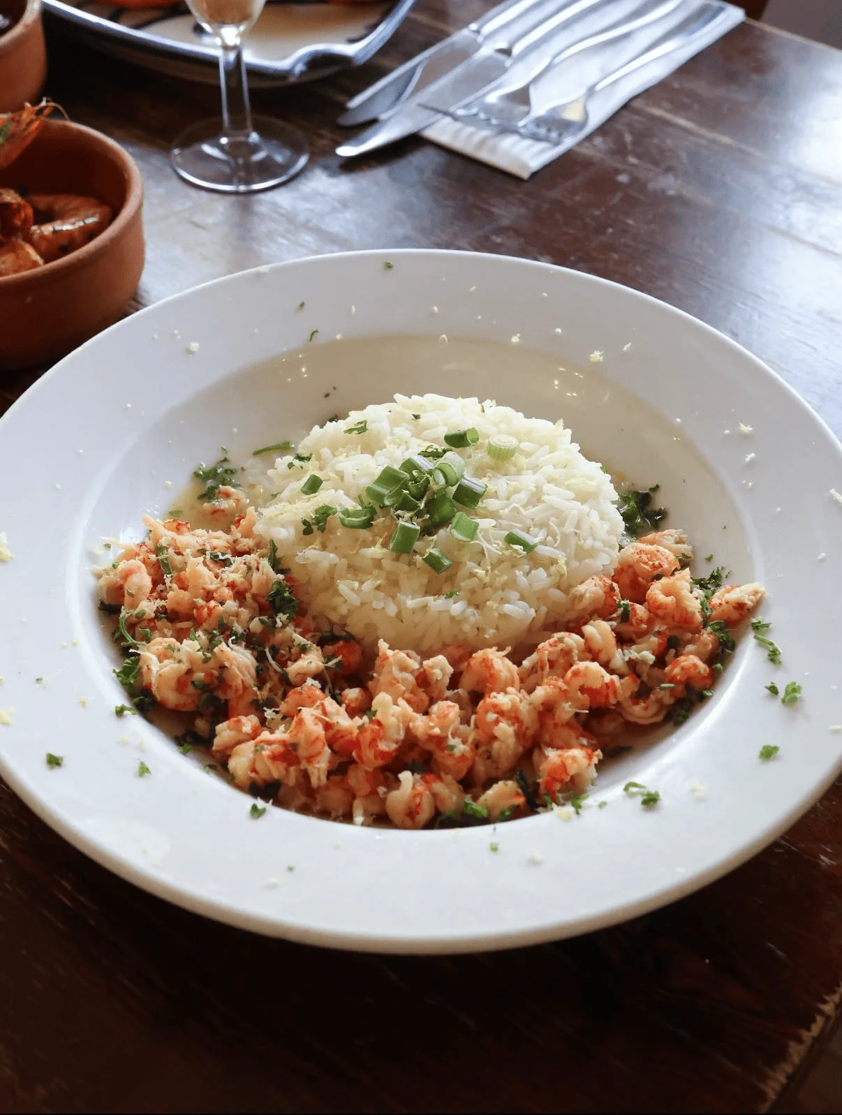 Crayfish in garlic butter served around a mound of lemon rice